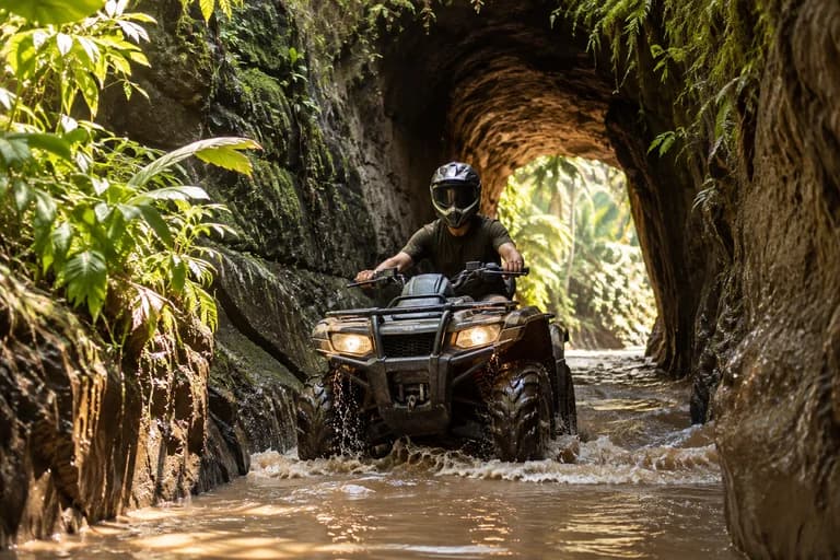 Illustration of a single rider on an ATV near a tunnel and waterfall
